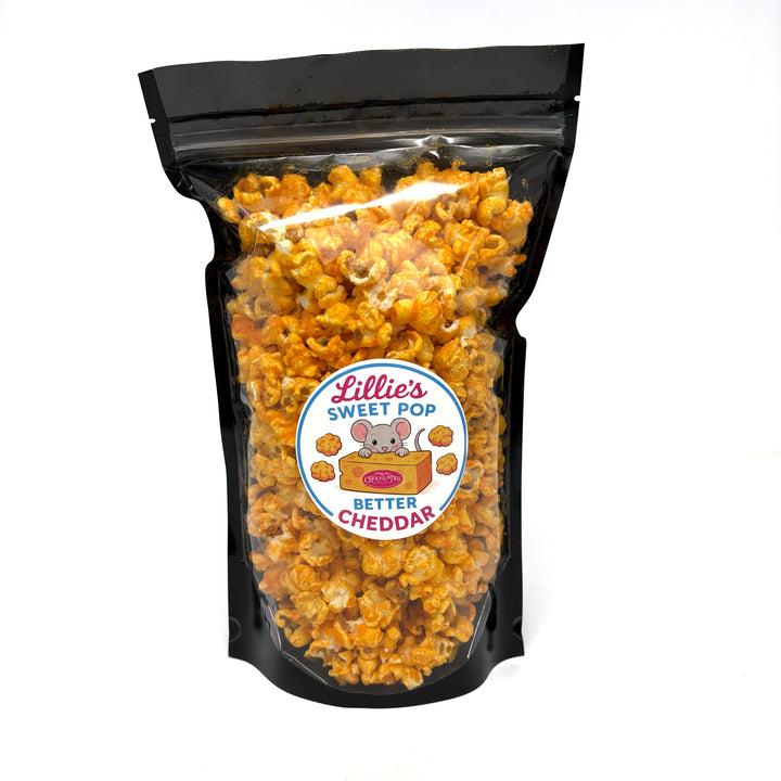 A bag of our cheesy and addictive Better Cheddar popcorn. Generously coated with a rich, creamy cheese blend that captures the essence of the Midwest.