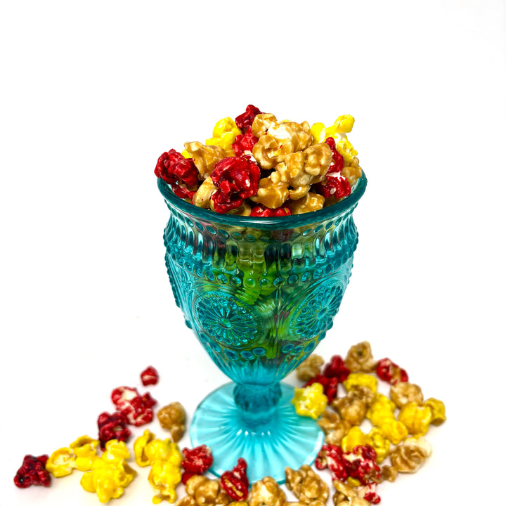 Our Cy Crunch Popcorn features our sweet and salty salted caramel corn, creamy vanilla popcorn, and a burst of tangy red cherry popcorn.