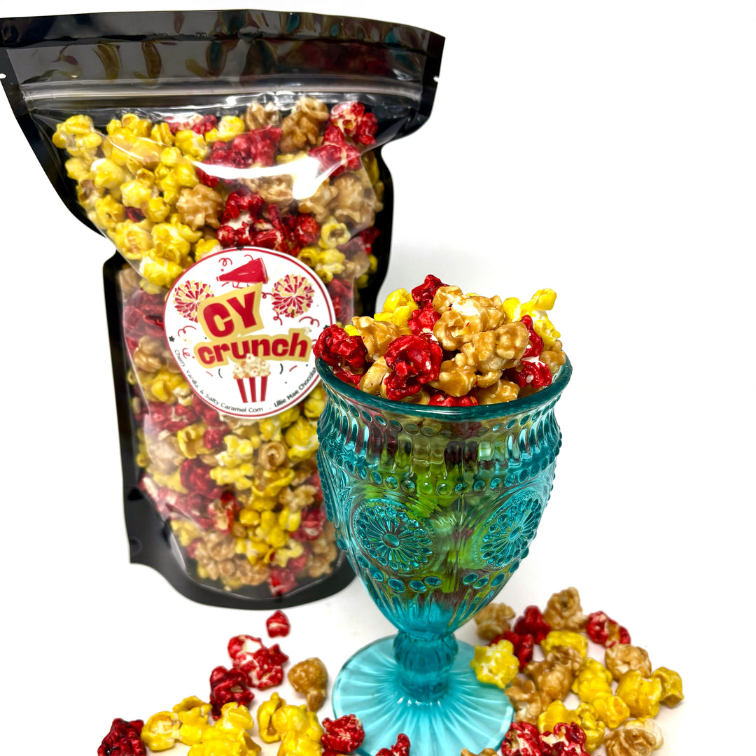 Our Cy Crunch Popcorn features our sweet and salty salted caramel corn, creamy vanilla popcorn, and a burst of tangy red cherry popcorn.