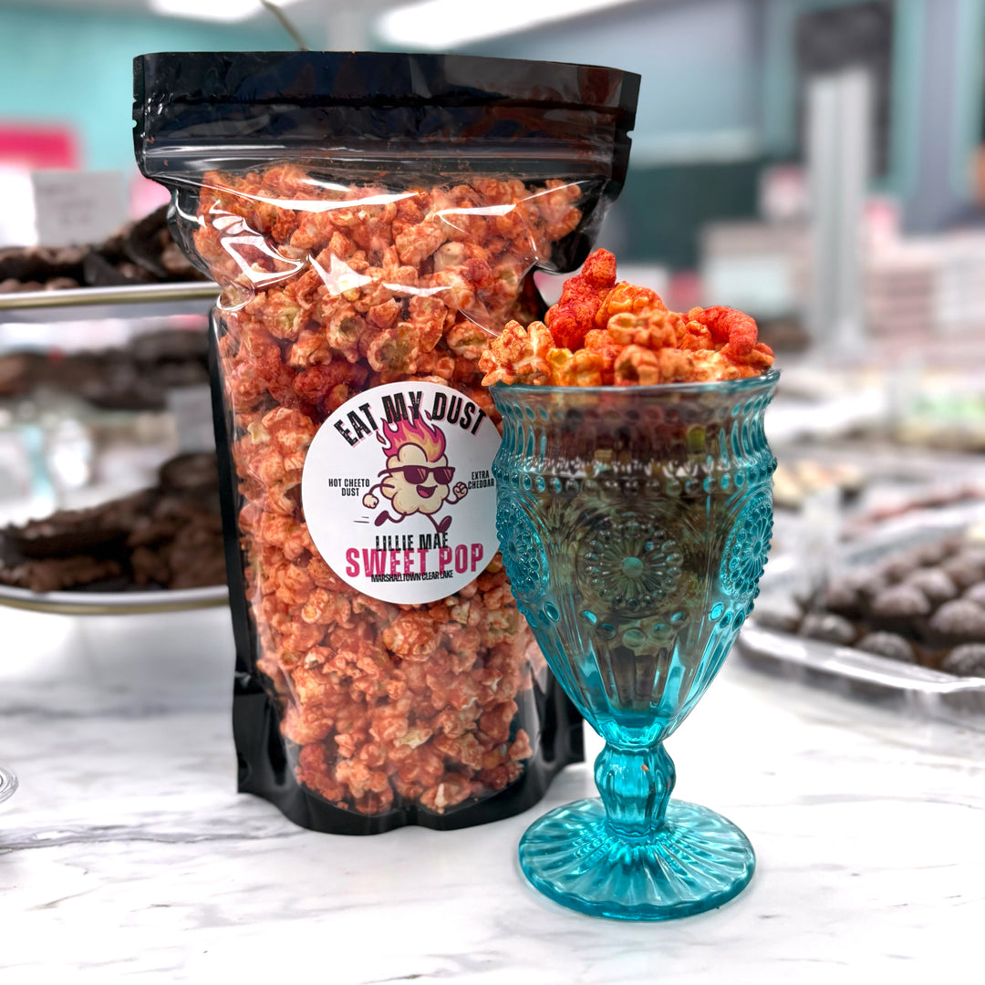  Our Eat My Dust Popcorn is a crave-worthy mix of White Cheddar and Better Cheddar popcorn that is coated in a light layer of fiery Hot Cheetos dust for a bold, cheesy heat that hits just right. Topped off with Hot Cheeto Dust and whole Hot Cheetos sprinkled throughout.