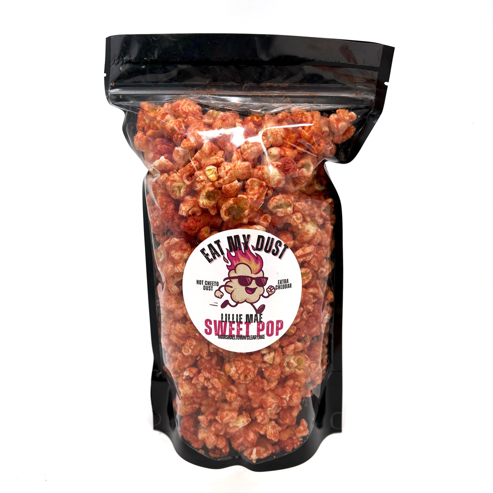  Our Eat My Dust Popcorn is a crave-worthy mix of White Cheddar and Better Cheddar popcorn that is coated in a light layer of fiery Hot Cheetos dust for a bold, cheesy heat that hits just right. Topped off with Hot Cheeto Dust and whole Hot Cheetos sprinkled throughout.