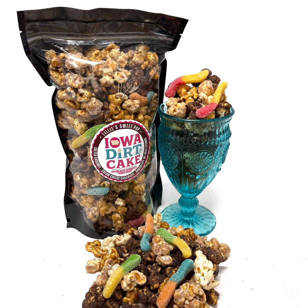Our Iowa Dirt Cake Popcorn has our cream cheese chocolate popcorn, chocolate covered vanilla salted caramel popcorn, and our buttery vanilla salted caramel popcorn. All dusted in Oreo dust and sprinkled with a few gummy worms.