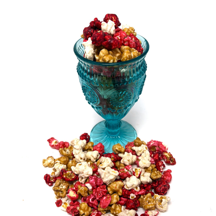 Our Just Bloomed Popcorn combines the fruity fresh flavors of raspberry, strawberry, and cherry with the rich flavors of vanilla and vanilla salted caramel popcorn.