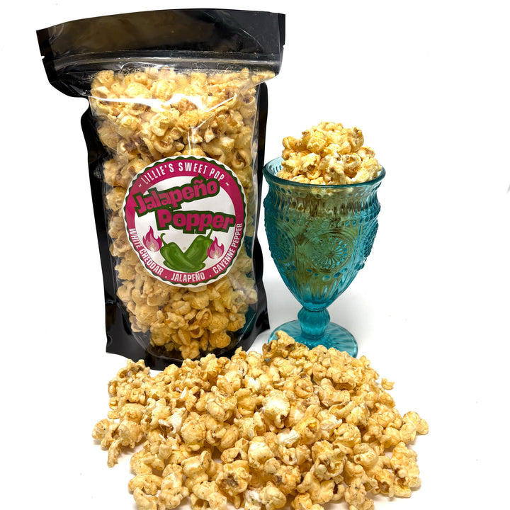 Jalapeño Popper Popcorn includes our white cheddar popcorn mixed with a punchy jalapeño cayenne pepper flavor!