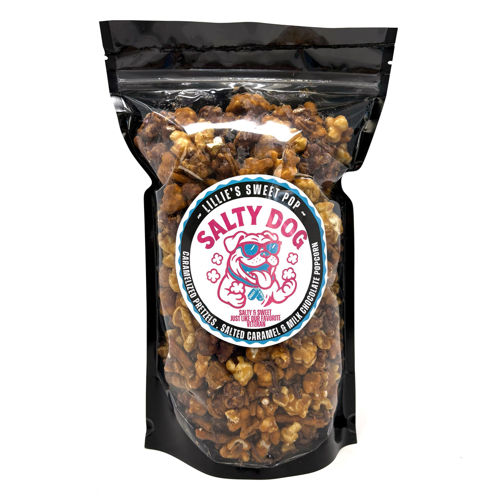Salty Dog has salted vanilla caramel popcorn immersed in milk chocolate paired with our classic salted vanilla caramel popcorn. Finished off with a drizzle of sea salt chocolate and caramel-coated pretzels.