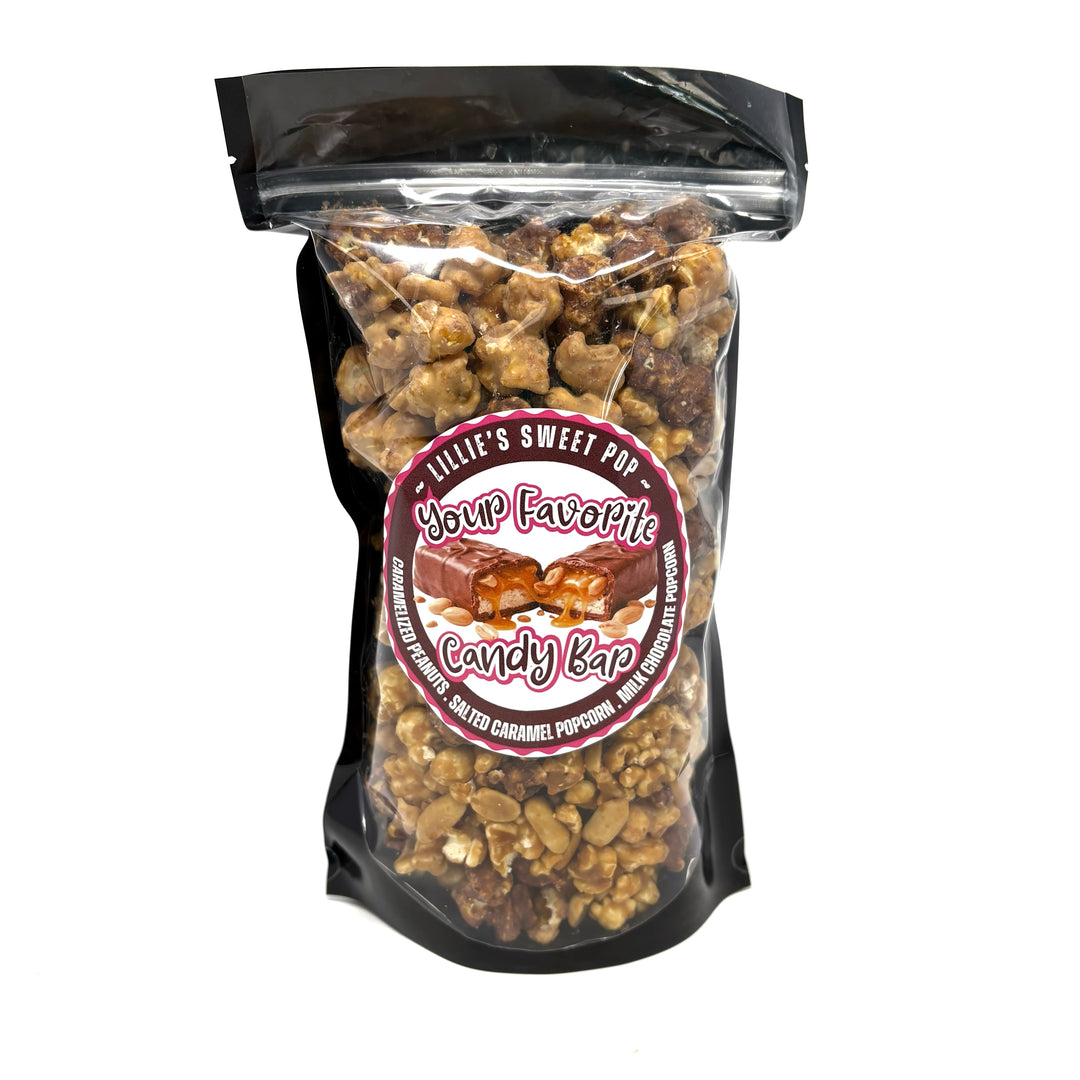 Your Favorite Candy Bar Popcorn includes a decadent chocolate-nougat blend that is combined with milk-chocolate-dipped salted vanilla caramel popcorn. Finished off with peanuts coated in our buttery caramel. 