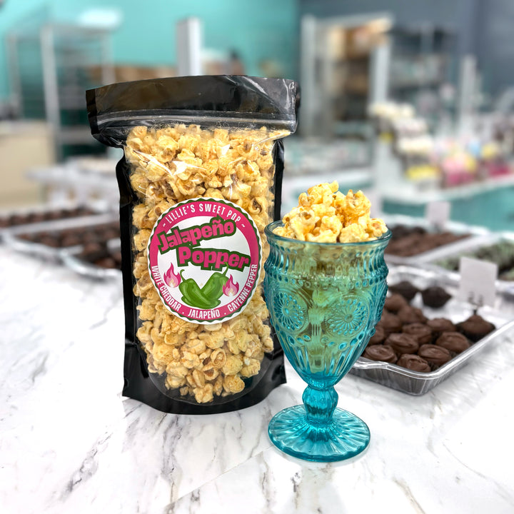 Jalapeño Popper Popcorn includes our white cheddar popcorn mixed with a punchy jalapeño cayenne pepper flavor!