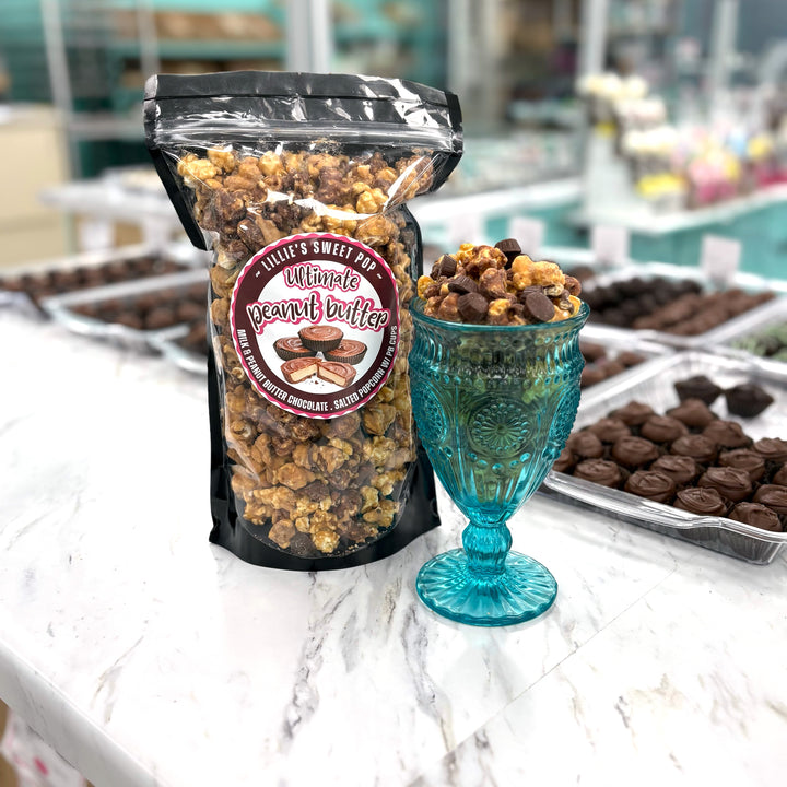 Our Ultimate Peanut Butter Cup Popcorn  includes a blend of milk chocolate popcorn, peanut butter chocolate popcorn, and salted vanilla popcorn. Finished off with mini peanut butter cups sprinkled throughout.