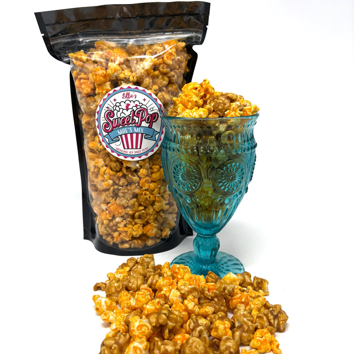 Mae's Mix Popcorn is a delicious blend of our buttery caramel popcorn and cheesy Better Cheddar popcorn.