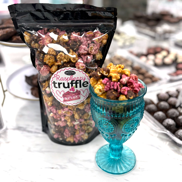 Our Raspberry Truffle Popcorn has a decadent blend of our buttery caramel popcorn, rich raspberry dark chocolate popcorn, and flavorful raspberry popcorn. 