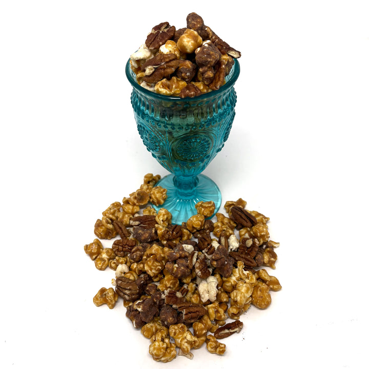 Our Tortush Popcorn has the flavors you know and love with our classic, buttery salted caramel popcorn and a blend of milk and white chocolate popcorn. Topped with caramelized pecans sprinkled throughout.
