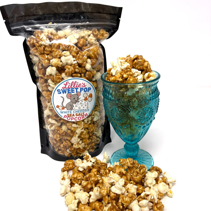 Our White Cheddar Sea Salt Popcorn combines the sharp, creamy taste of real cheddar cheese with the rich, buttery sweetness of our salted caramel popcorn.