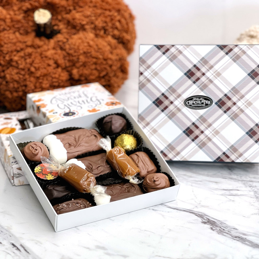A Deluxe assortment medium size gift box with all of your favorites in this cute fall gift box including a soft center creams, TorTush, truffles, sea salt caramels, chocolate covered caramels and wrapped caramel! Perfect for the holidays!!